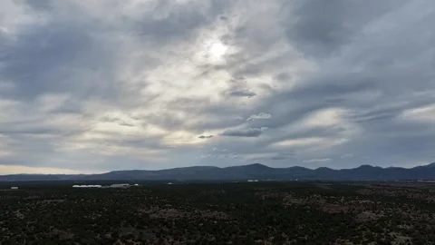 4K UHD Drone Timelapse: Silver Grey Clouds Drifting Over Southwest Mesa Stock Footage 337624743
