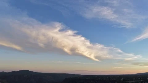 4K UHD Drone Timelapse: Unique Angled Cloud Formation Shifting Over Mountain Stock Footage 337707484