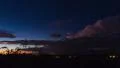 4K UHD dusk stray storm cell heads over mountains colorful time lapse 4k or 4k+ Resolution