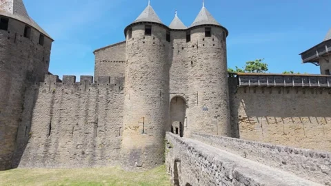4K UHD dynamic handheld shot approaching medieval stone castle gate Stock-Footage 347136161
