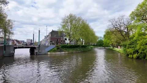 4K UHD dynamic handheld shot of Utrecht canal with lock gate opening Vídeos de archivo 347200872