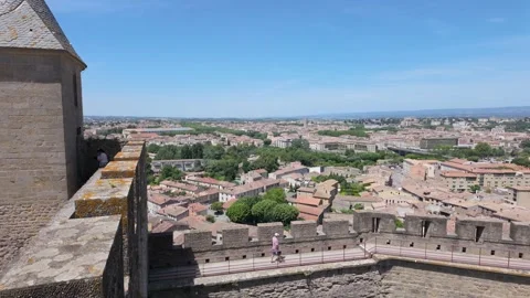 4K UHD dynamic panning shot from medieval castle tower over town Stock-Footage 347137955