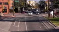 4K UHD establishment shot downtown main one way street facing traffic tight 4k or 4k+ Resolution