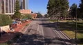 4K UHD establishment shot downtown main one way street facing traffic zoom in 4k or 4k+ Resolution