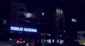4K UHD establishment shot public parking entrance generic night neon car enters 4k or 4k+ Resolution