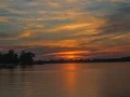 4K UHD Evening sun descending behind the clouds - time lapse 4k or 4k+ Resolution
