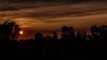 4K UHD Evening sun descending behind the clouds - time lapse 4k or 4k+ Resolution