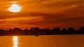 4K UHD Evening sun descending behind the clouds - time lapse 4k or 4k+ Resolution