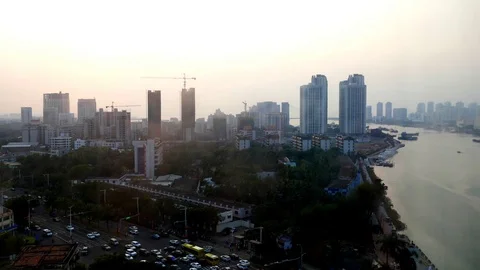 4k UHD evening time lapse of Chang Di Road Haidian River Haikou Hainan China Stock Footage 123274108