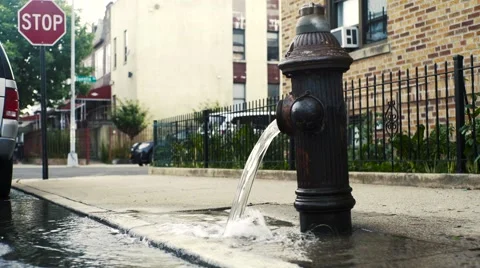 4K UHD Fire Hydrant Running on City Street Stockbeeldmateriaal 67422398