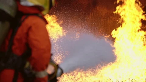 4k UHD Firefighter using Chemical foam fire extinguisher to fighting with the Stock Footage 146883988