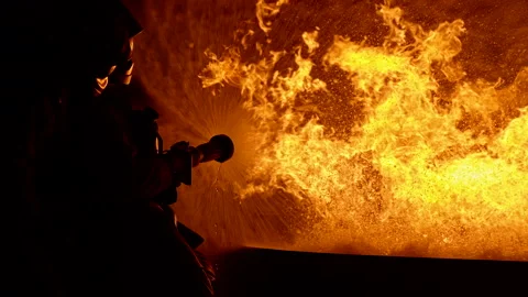 4K UHD Firefighters using Twirl water fog type fire extinguisher to fighting  Stock Footage 146883892