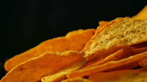 4K UHD footage of triangle nacho chips slowly rotating, close up Stock Footage 86405848