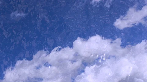 4K, UHD, Gentle waves on cloudy background streams slowly Stock Footage 41435939