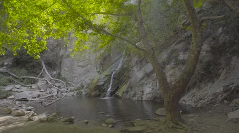 4k UHD Gliding towards a waterfall in the canyon Stock Footage 62847158
