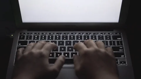 4K UHD Hands Typing on Laptop in Dark POV Stock Footage 74700660
