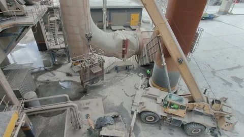 4K UHD: Heavy Crane Lifting Steel Structure in Cement Factory. Stock Footage 331825464