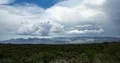 4K UHD large thunderhead buildup over mountain range and rain time lapse 4k or 4k+ Resolution