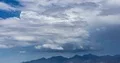 4K UHD large thunderhead buildup over mountain range and rain time lapse 4k or 4k+ Resolution