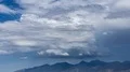4K UHD large thunderhead buildup over mountain range and rain time lapse 4k or 4k+ Resolution