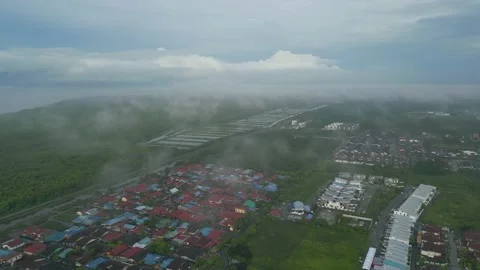 4K UHD low cloud over typical residence of small town in morning Stock Footage 227516048