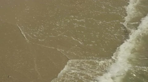 4K UHD Medium of Waves on Beach High Angle Stock Footage 62355563