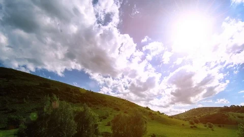 4K UHD mountain meadow timelapse at the summer. Clouds, trees, green grass and Stock Footage 90236243