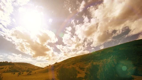 4K UHD mountain meadow timelapse at the summer. Clouds, trees, green grass and Stock Footage 127383431