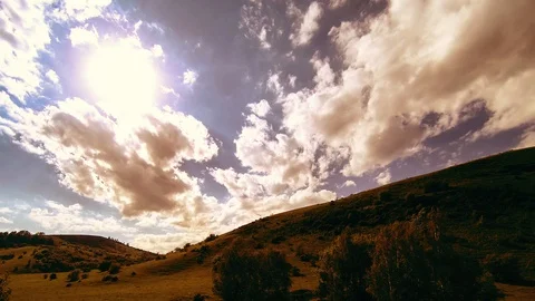 4K UHD mountain meadow timelapse at the summer. Clouds, trees, green grass and Stock Footage 129262369