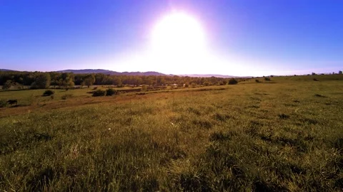 4K UHD mountain meadow timelapse at the summer. Clouds, trees, green grass and Stock Footage 152983595