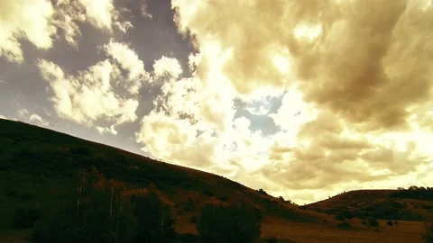 4K UHD mountain meadow timelapse at the summer. Clouds, trees, green grass and Stock Footage 169646712