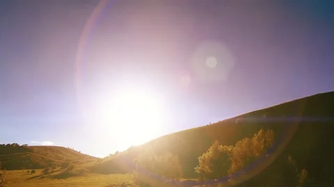 4K UHD mountain meadow timelapse at the summer. Clouds, trees, green grass and Stock Footage 222508693
