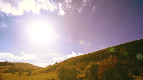 4K UHD mountain meadow timelapse at the summer. Clouds, trees, green grass and Stock Footage 269510438