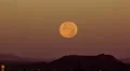 4K UHD NTSC wide supermoon set over desert mountains in the morning 4k or 4k+ Resolution