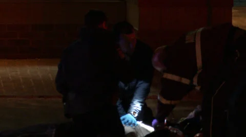 4K UHD - Officers doing CPR victim not showing Stock Footage 35003853