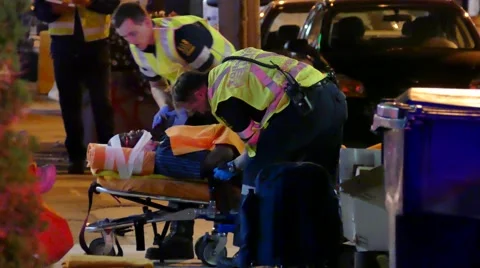 4K UHD - Paramedic crews strapping patients onto stretchers Stock-Footage 56441555