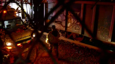 4K UHD - Paramedic looking at dead body under train at night 스톡 동영상 52623871