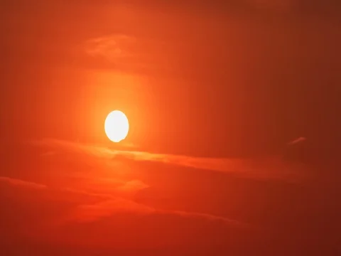 4K UHD Partial solar eclipse on an overcast evening - time lapse Stock Footage 72902854