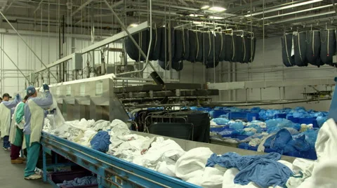 4K UHD shot of workers and clothes in industrial laundry factory Video stock 49217229