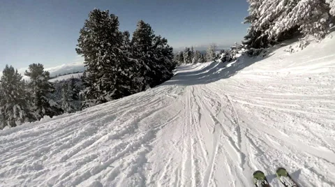 4K UHD:  Skier goes down by hill in snowy forest Stock-Footage 46778334