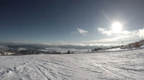 4K UHD:  Skier goes down by hill in snowy forest Stock-Footage 47410400