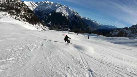 4K UHD slow motion of a snowboard pro rider in ski resorts of Courmayeur that Stock Footage 142794996