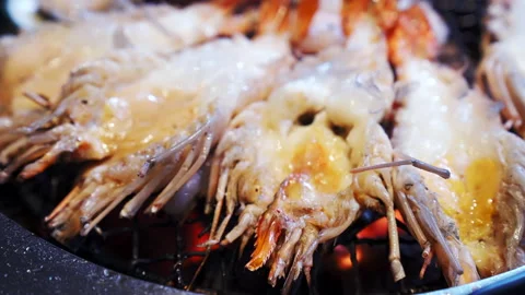 4K UHD Slow motion Zoom out close up Yakiniku style cooking of grilled tiger  Stock Footage 146897663