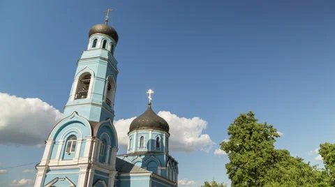 4K, UHD. Time lapse of moving clouds over a blue church. Summer time. Stock Footage 51323458