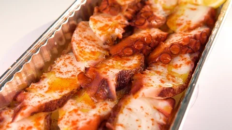 4K UHD video of chef squid or octopus set rotating in to go tray in slow motion Stock Footage 119838758