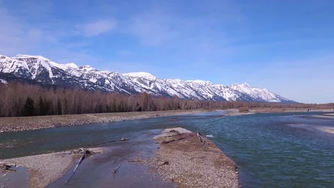 4K UHD view of river and mountain range byGrand Teton in Wyoming Видео 75540857