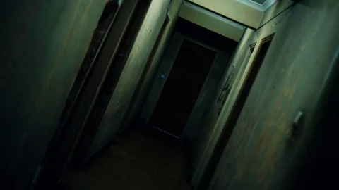 4K UHD Walking inside a long dark hallway of old apartment building Stock Footage 72323486