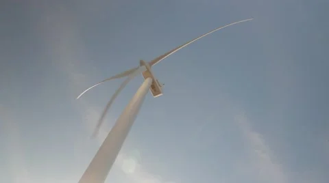 4k UHD wind Turbine medium shot spinning in the wind with power Stock Footage 45424121