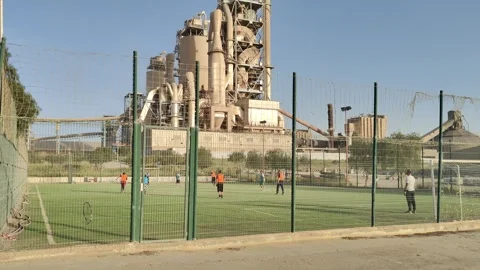 4K UHD: Workers Playing Soccer Inside a Massive Cement Factory, Algeria 動画素材 333239037