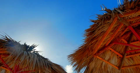 4K Umbrella Thatch Huts, Tropical Weather, Blue Sky and Sun Video stock 46839092